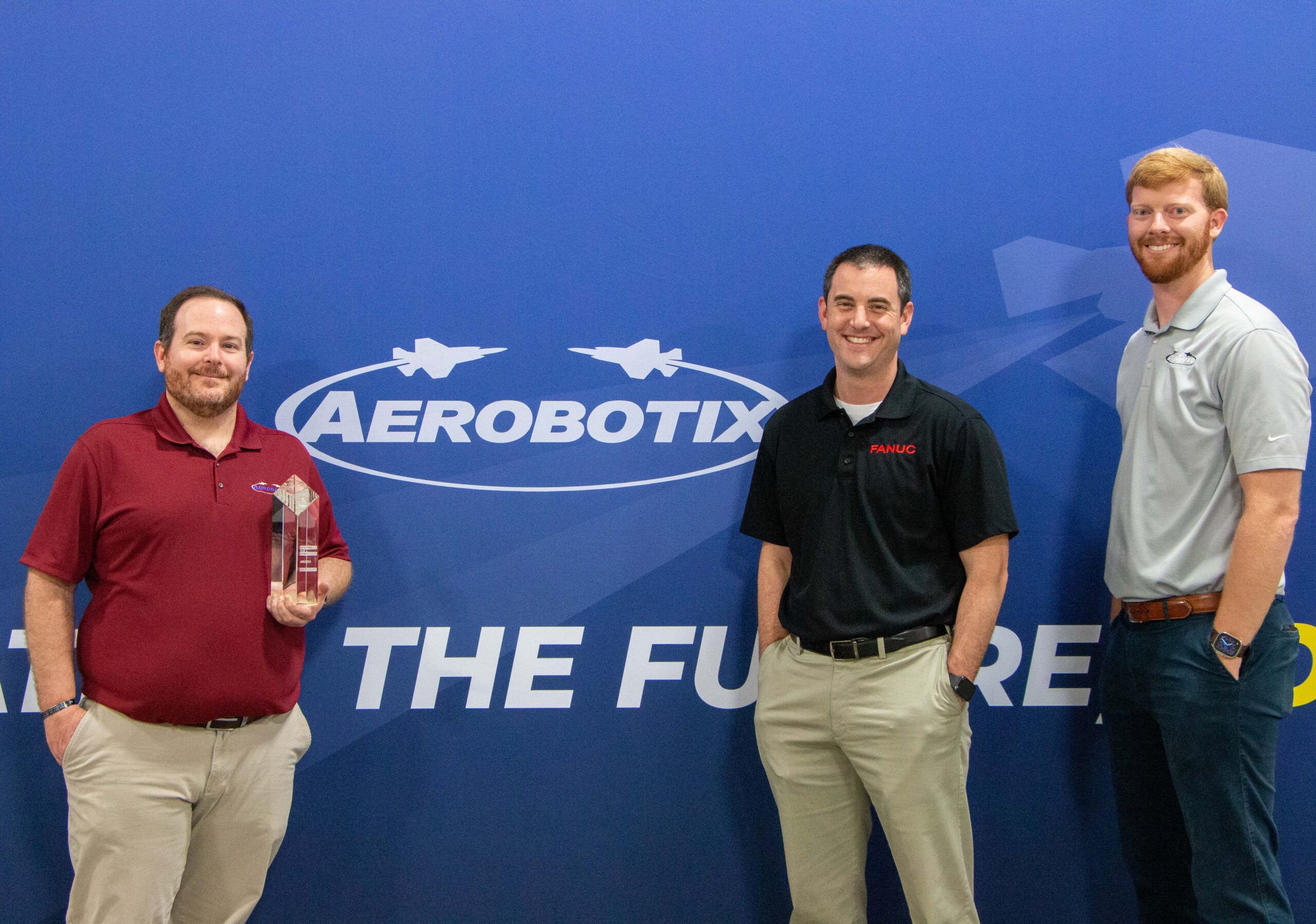 FANUC America present Aerobotix sales team with the 2022 Outstanding Growth Award.