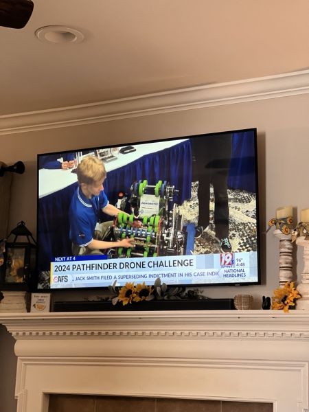 RAD Robotics is featured in a local news segment. An Aerobotix project engineer captured a screenshot of their robot with the Aerobotix logo.