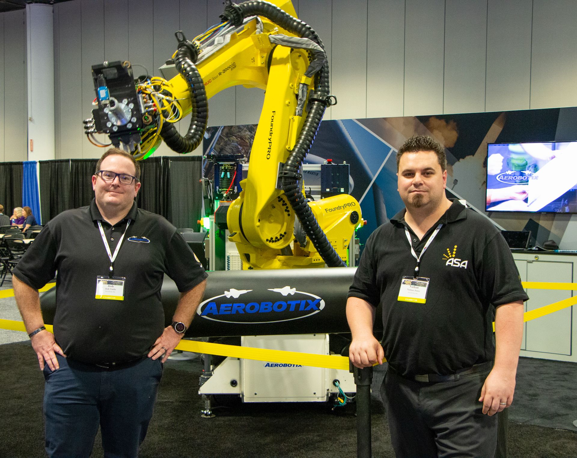Aerobotix's Josh Tuttle, left, and ASA's Nathan Jones, right, pose for a picture at DMC 2022 in Tampa, Florida.