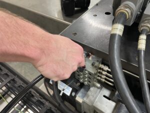 Robot Technician adding grease to a system.